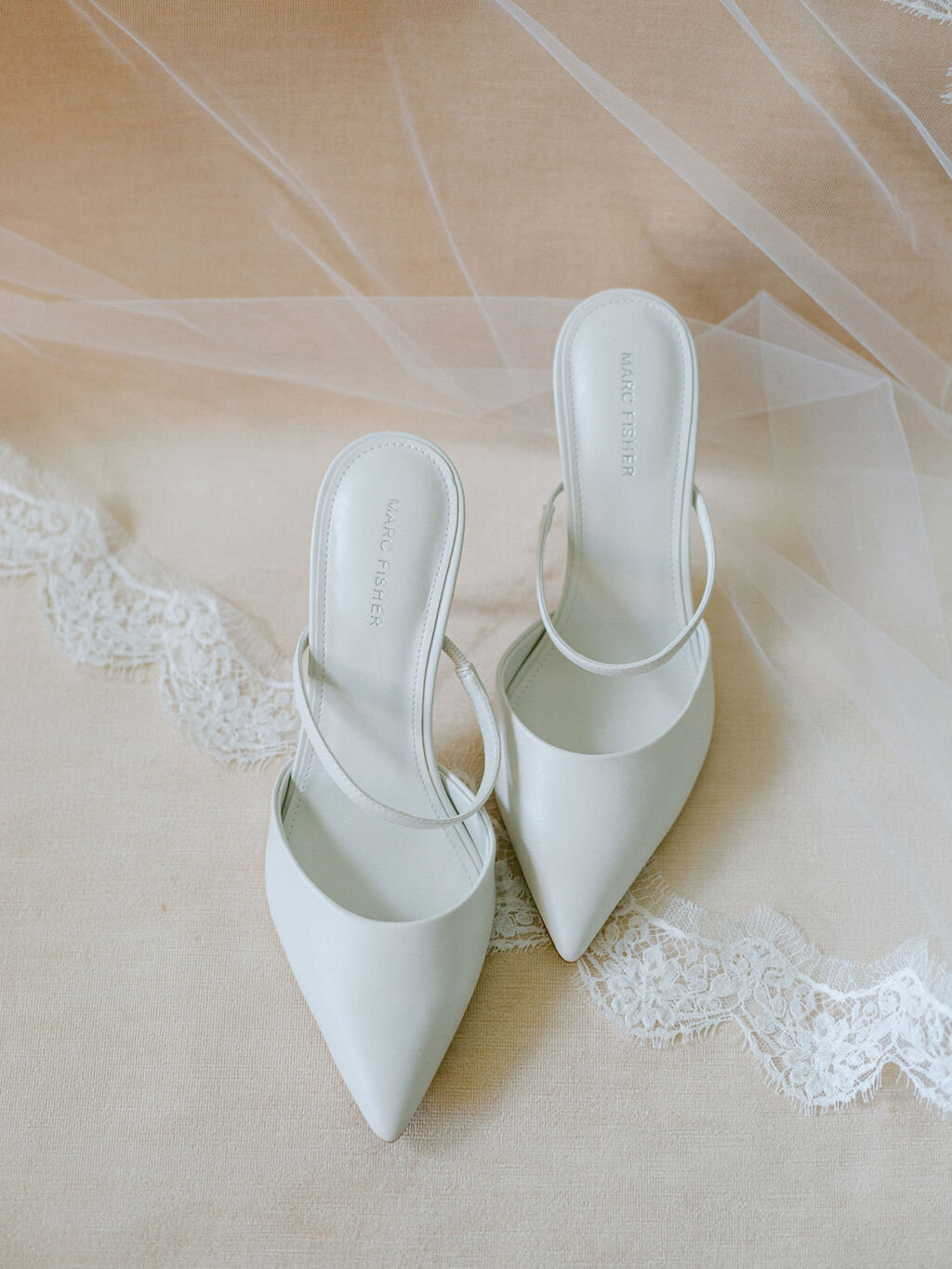 White wedding shoes on a lace veil for a wedding in Thomasville Georgia