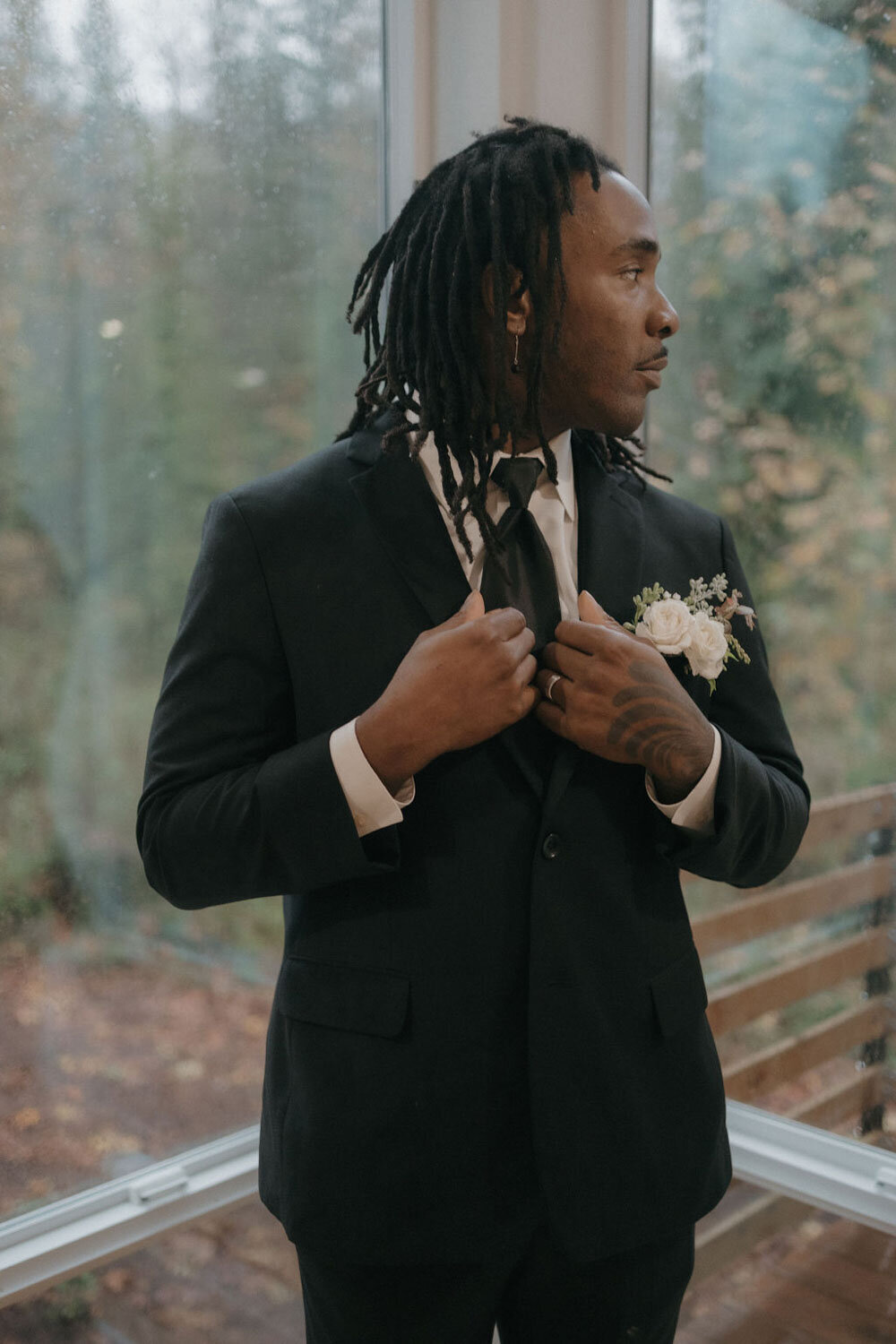 Groom in his suit looking behind