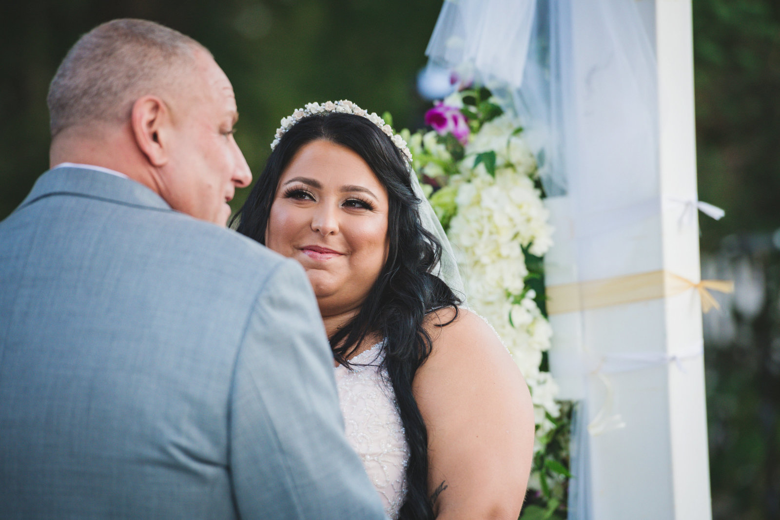 photo of bride and groom during wedding ceremony at Sea Cliff Manor