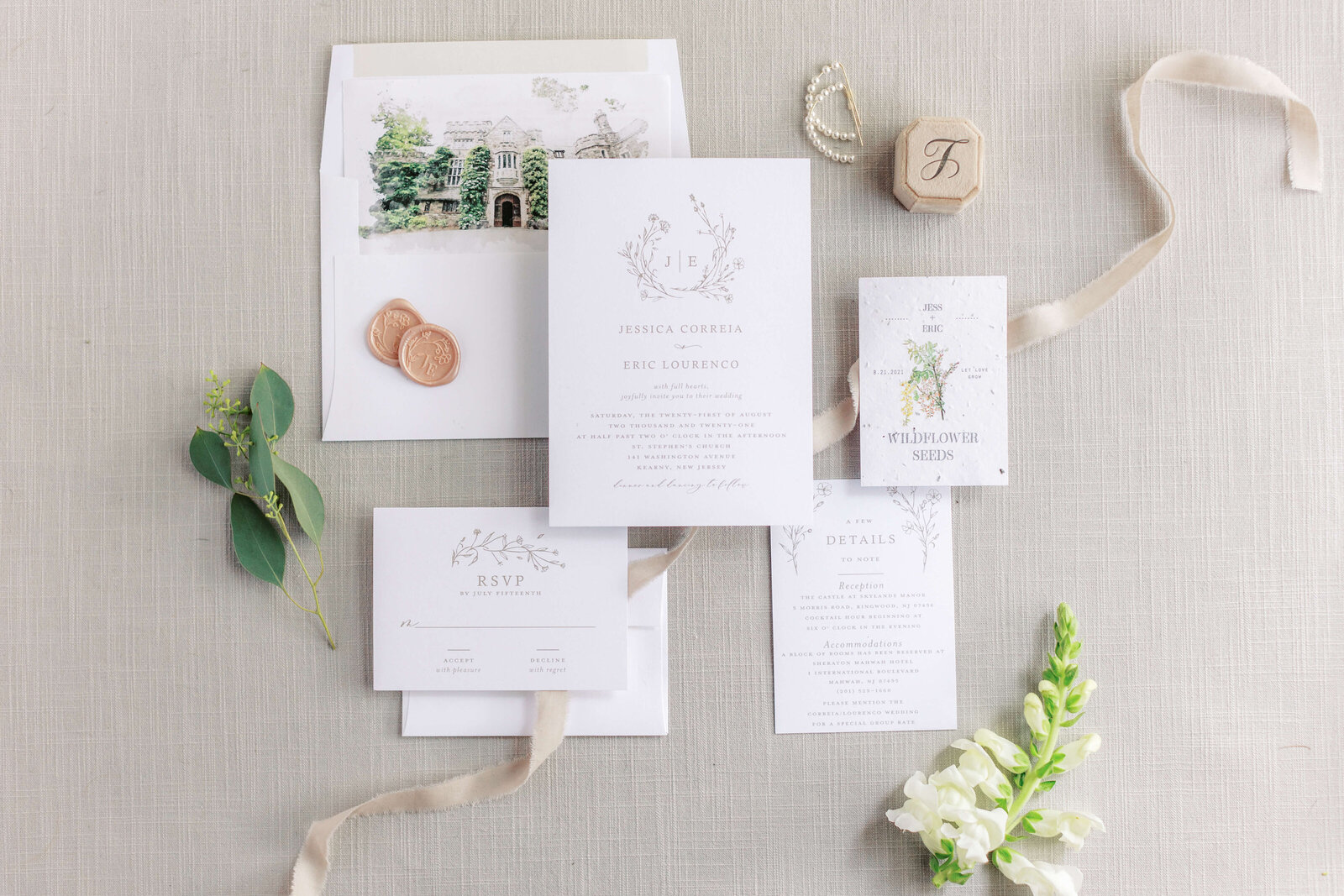 Professionally designed custom invitation suite with watercolor art and custom wax seal.