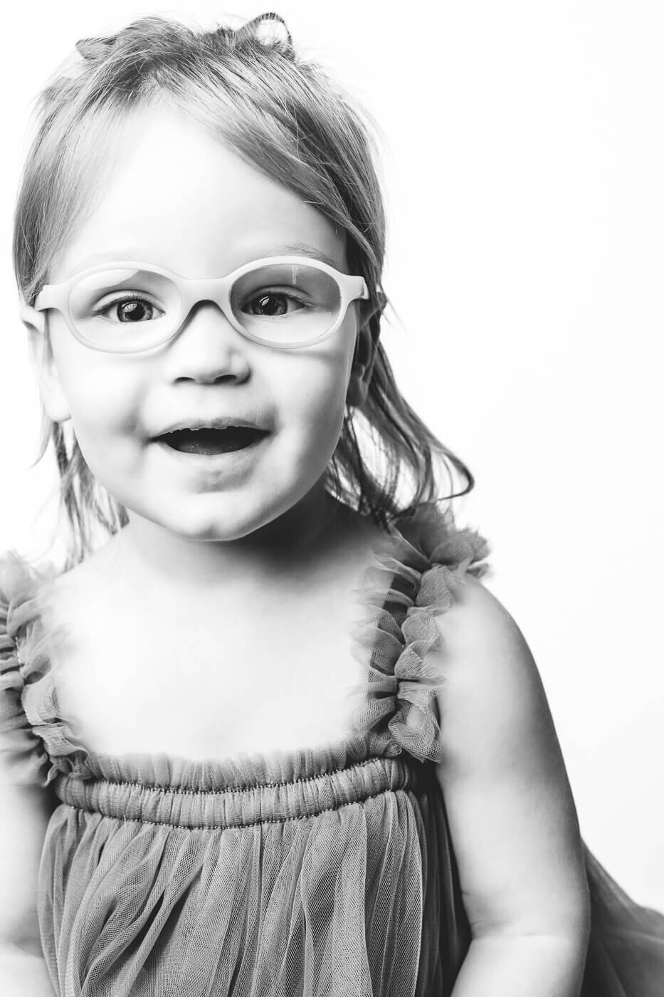 sweet girl with glasses talking to her mother