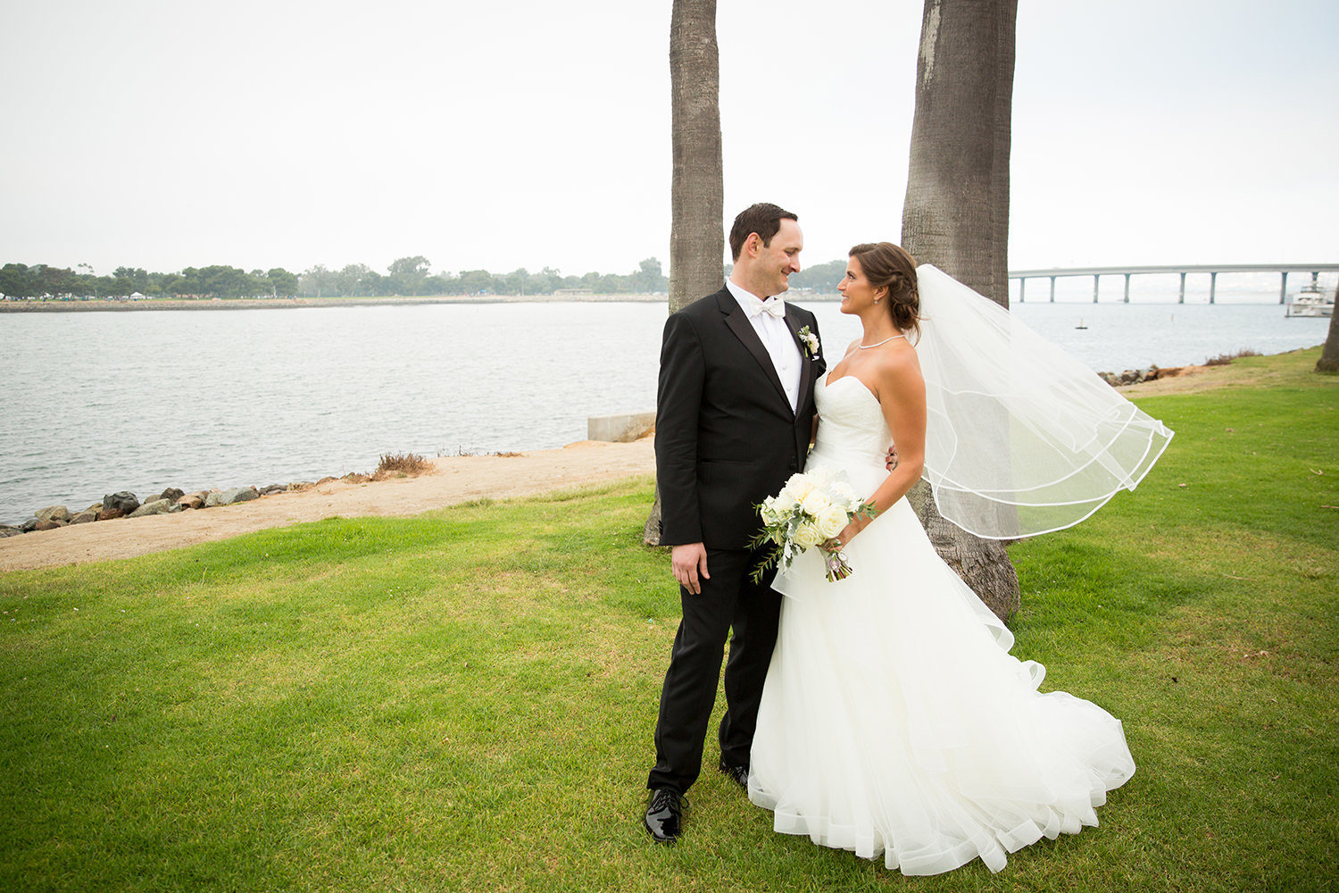 bride and groom by bay at the dana