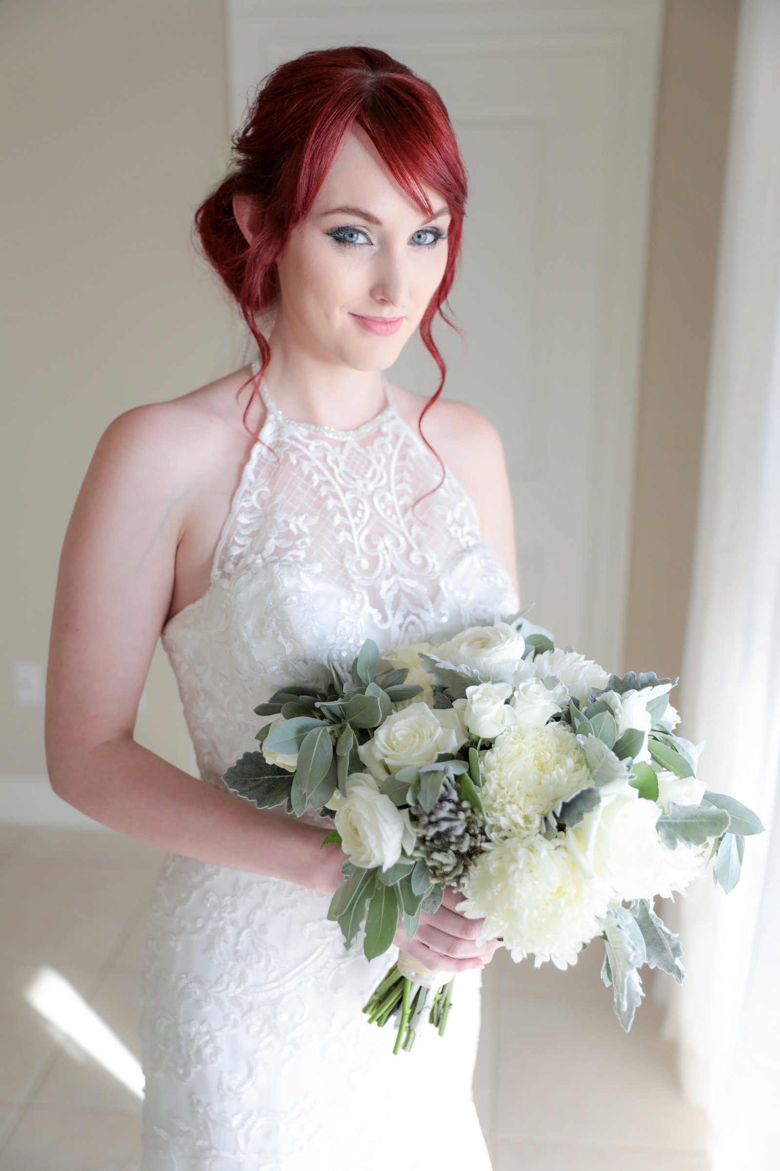 Sarasota-Bradenton Wedding Photography of bride with her bouquet at the window