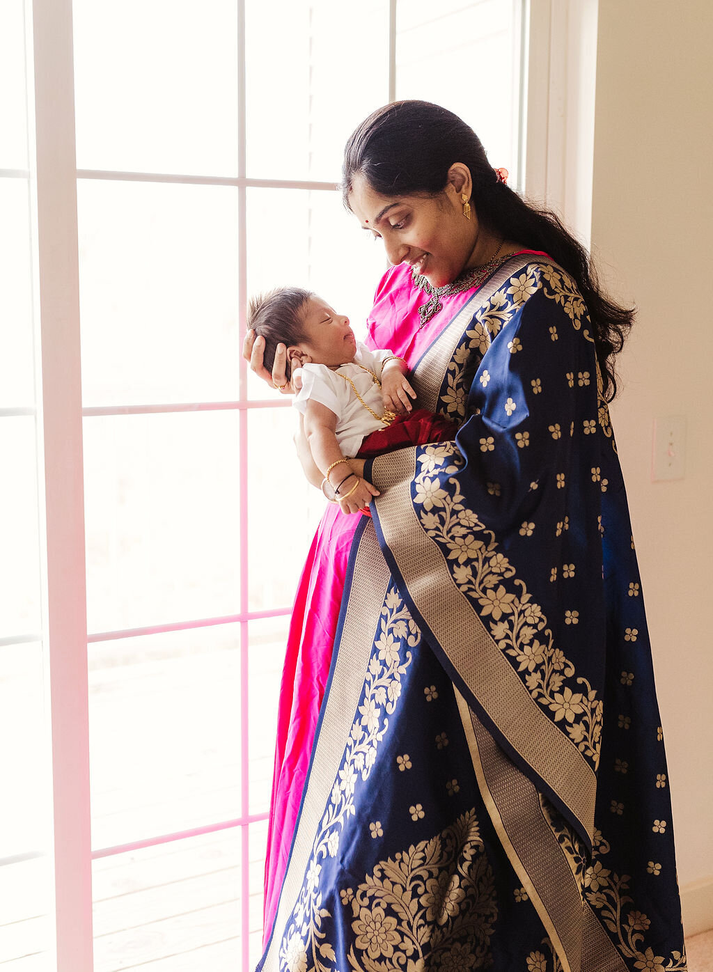 newborn baby with mom in indian clothing