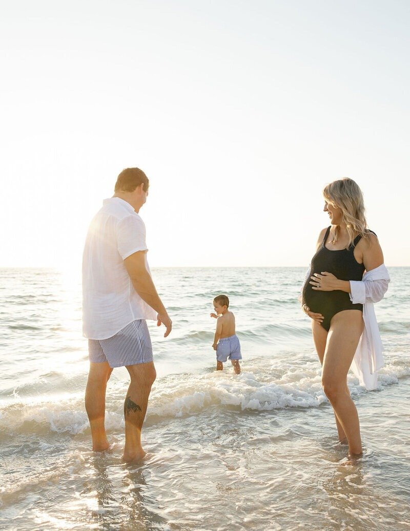 family playing in Naples Florida beach, photographed by Veronica Costa