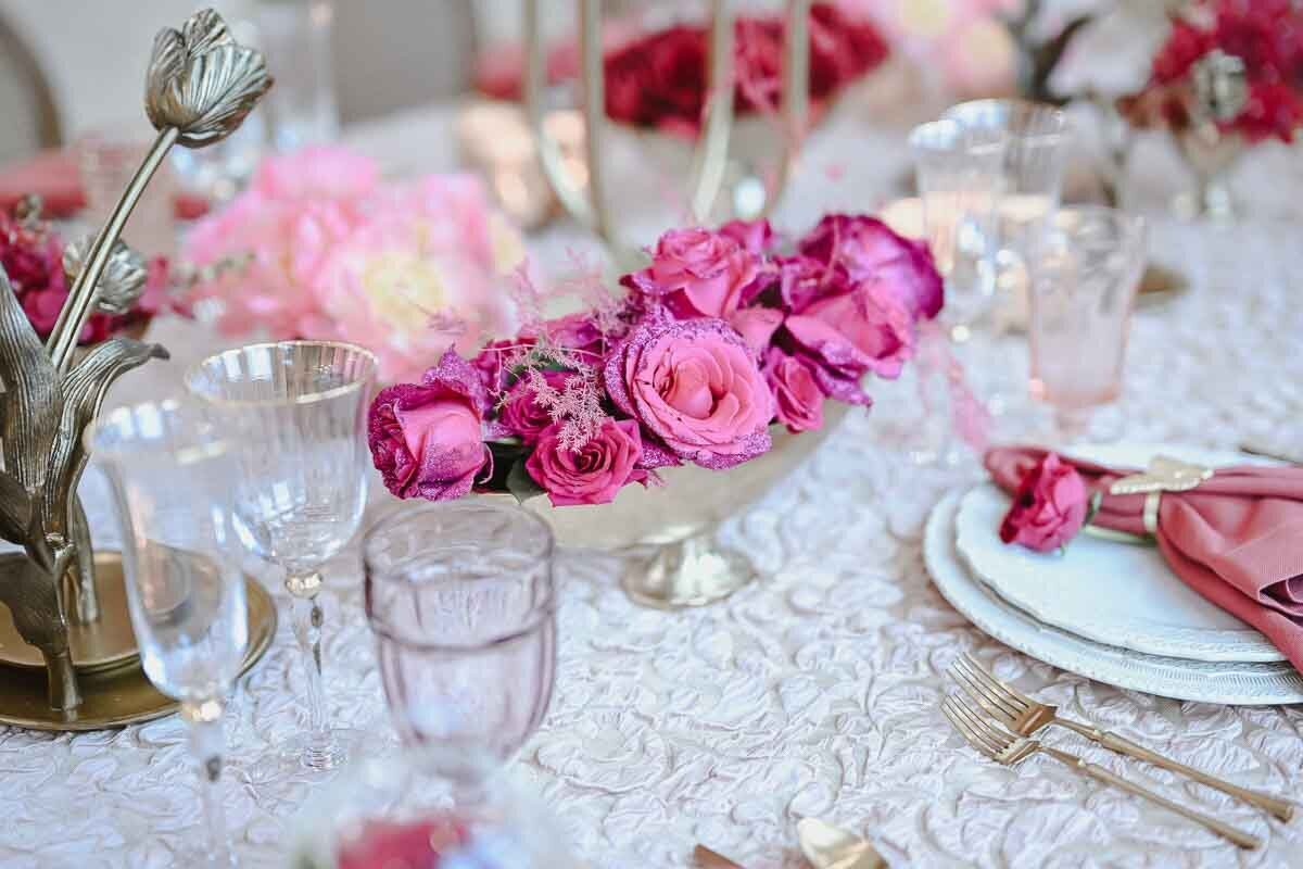 close up shot of floral arrangement featured in wedding dining table