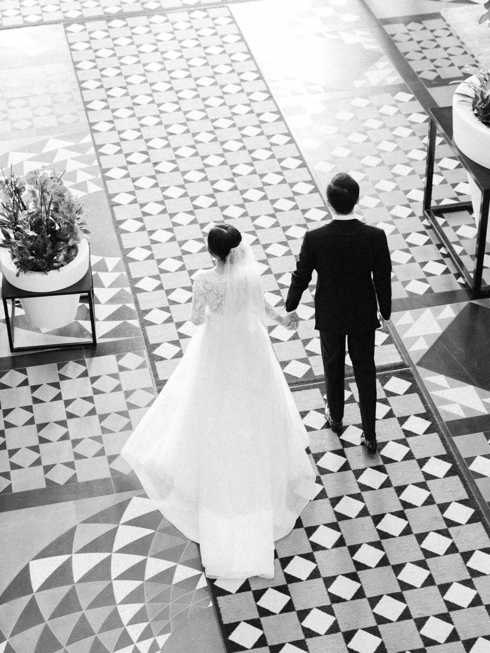 bride and groom walking in hotel x lobby
