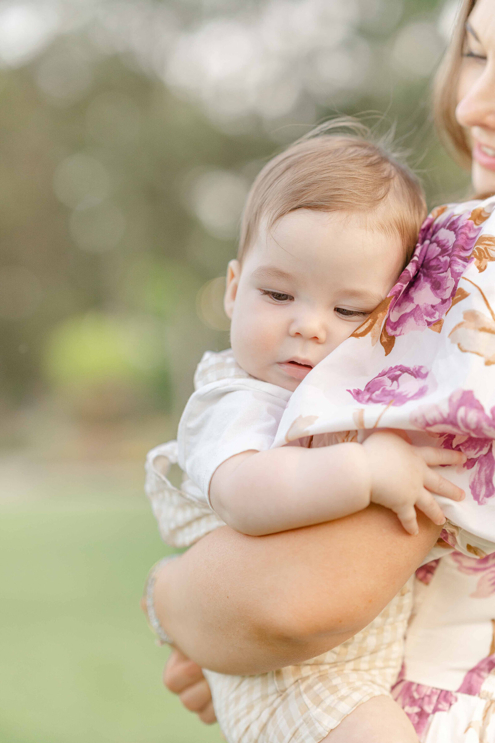 baby hugs mom during Fairfax County, Virginia spring minis