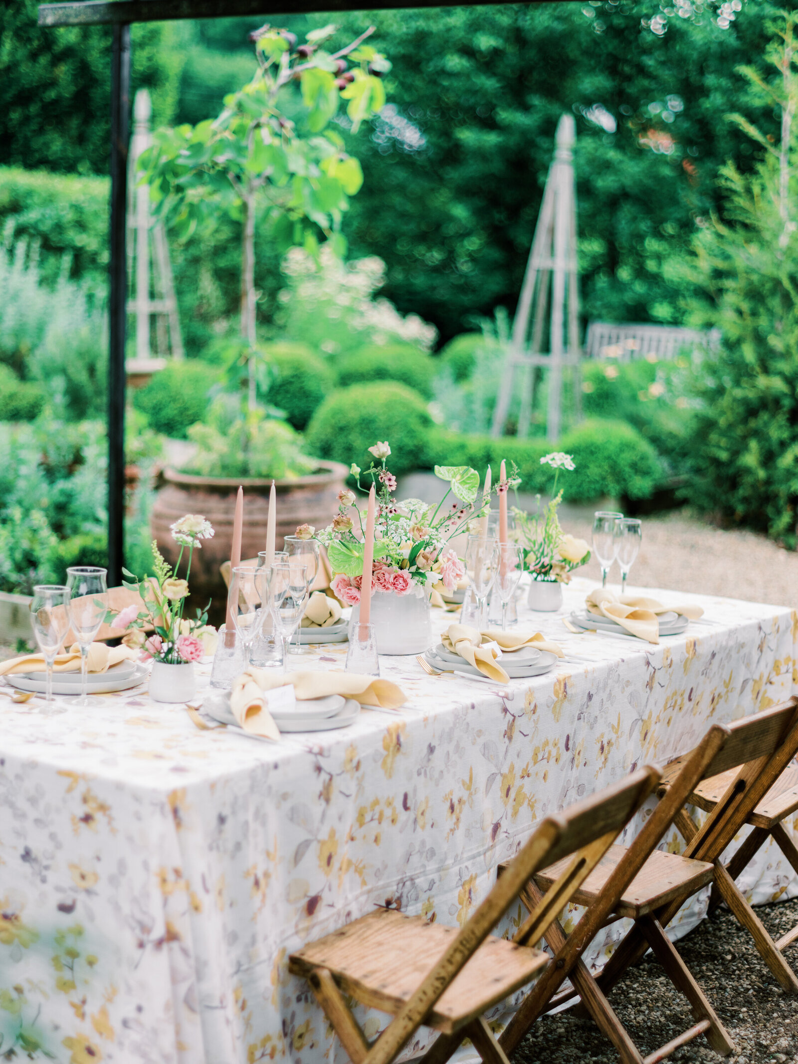 Dinner table set for guests in a garden