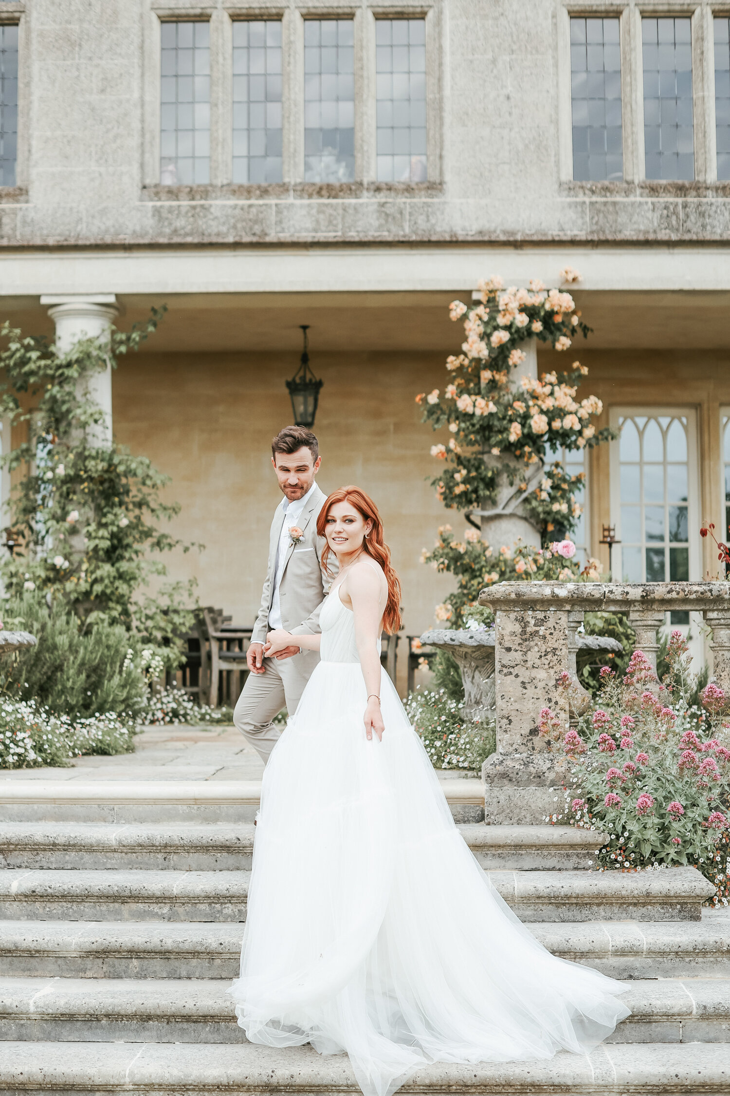 Euridge-Manor-wedding-bride-and-groom-walking-upstairs