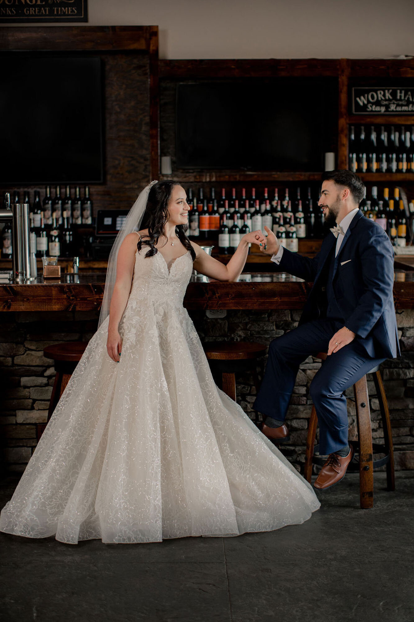 Bride and groom at bar after North Carolina destination wedding