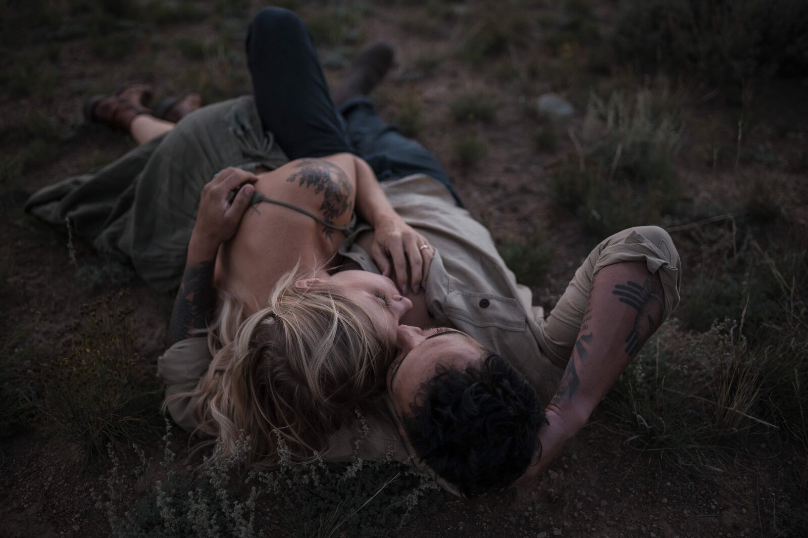 Bride and groom embracing on a mossy lava field in Iceland

