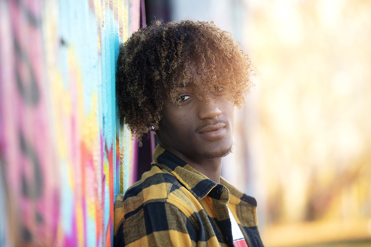 Frisco senior looks at camera duing photography session