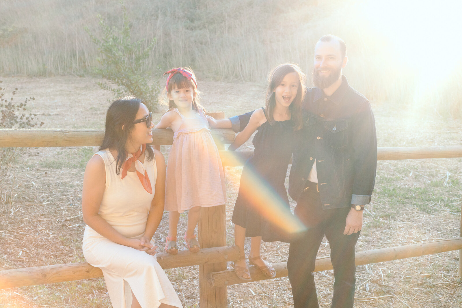 A family poses for photos in a forest in Los Angeles, Ca.