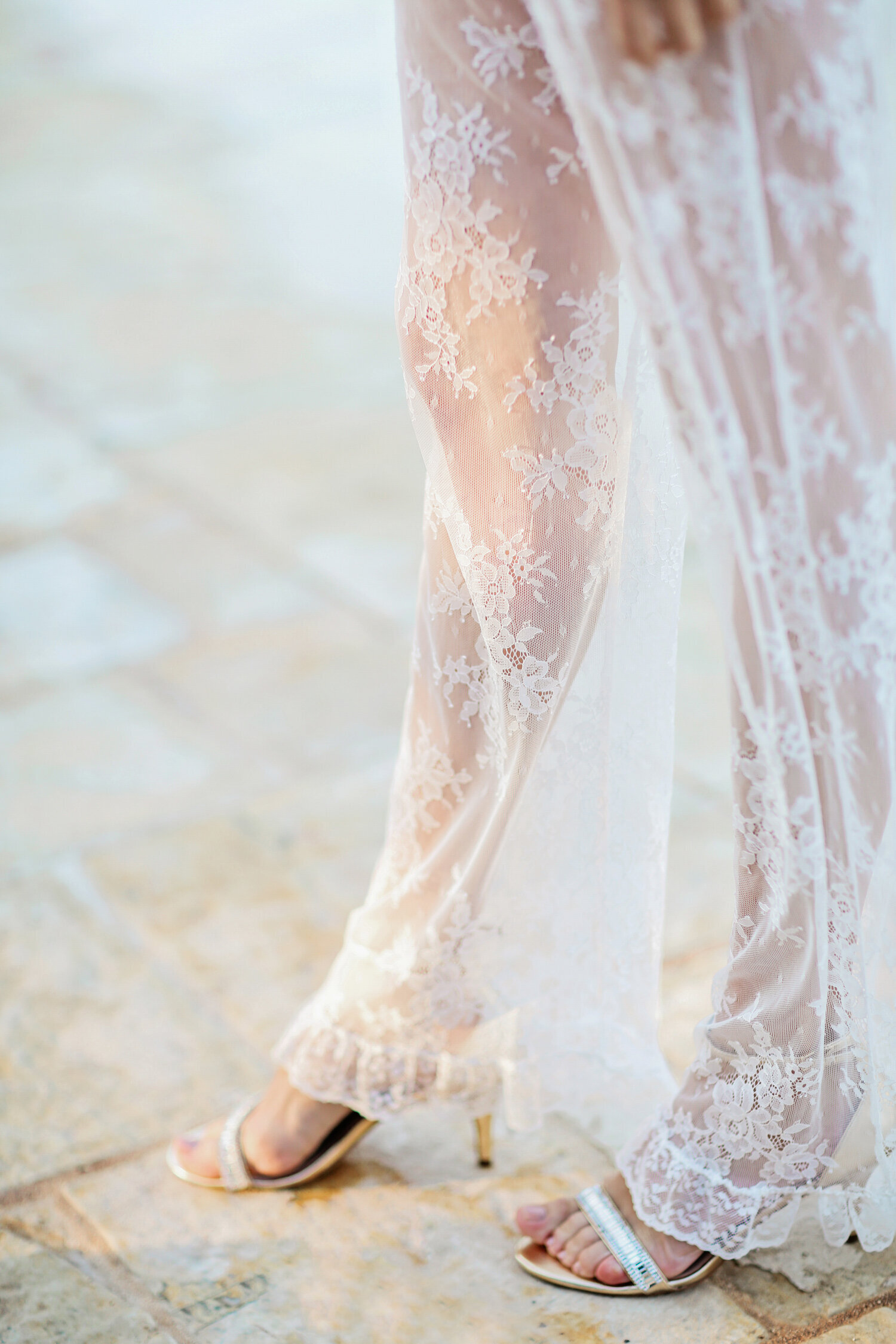 brides-leg-with sun-coming-through-lace-dress