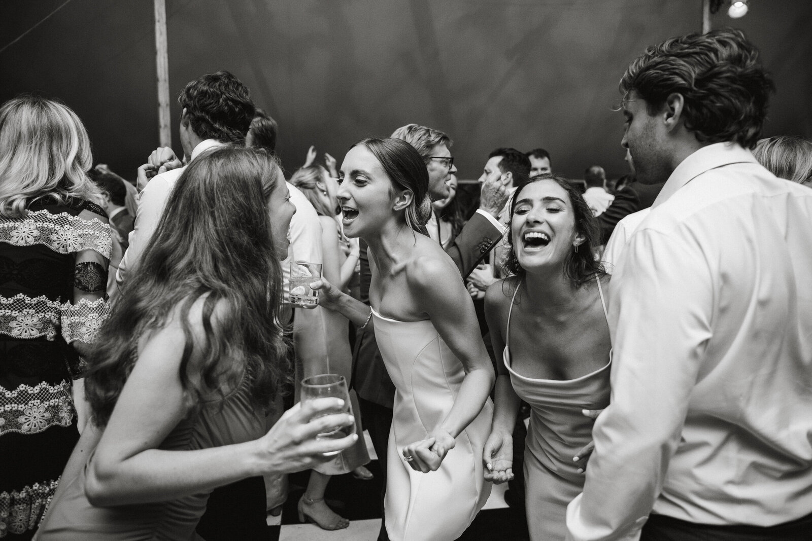 Guests celebrating at a tented reception in Philadelphia.