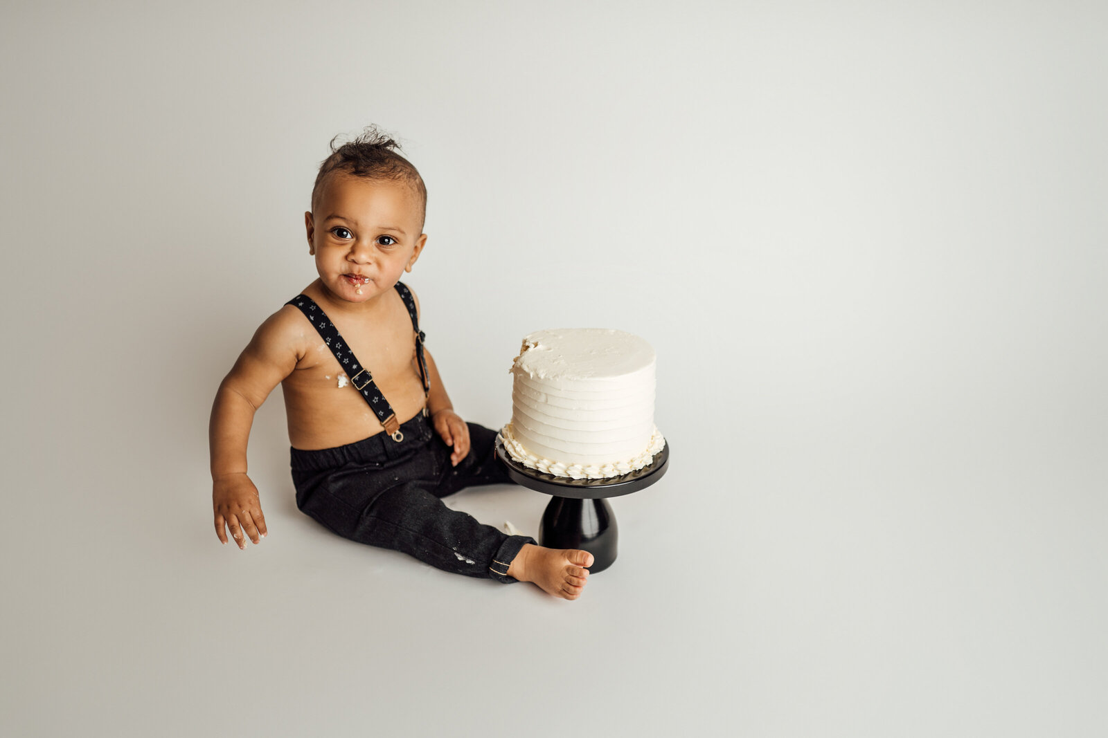 boy on white during cake smash photography session in Wesley Chapel
