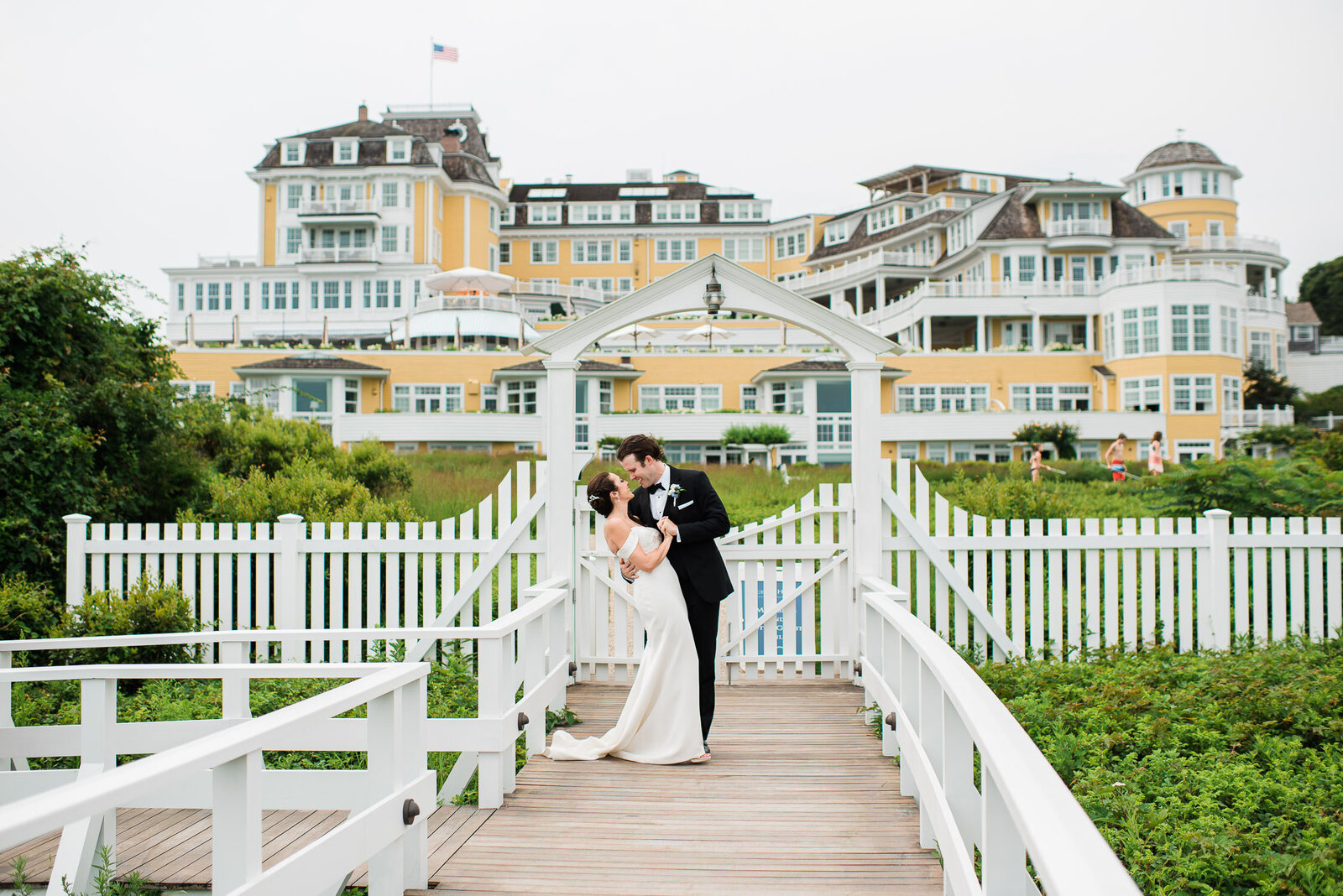 bride and groom dip on dock of Ocean House