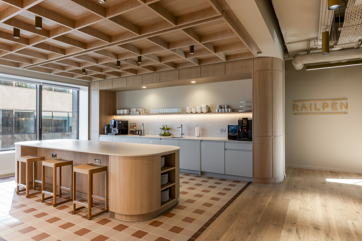 Modern London office interiors – custom joinery and tiles enhancing workplace design.