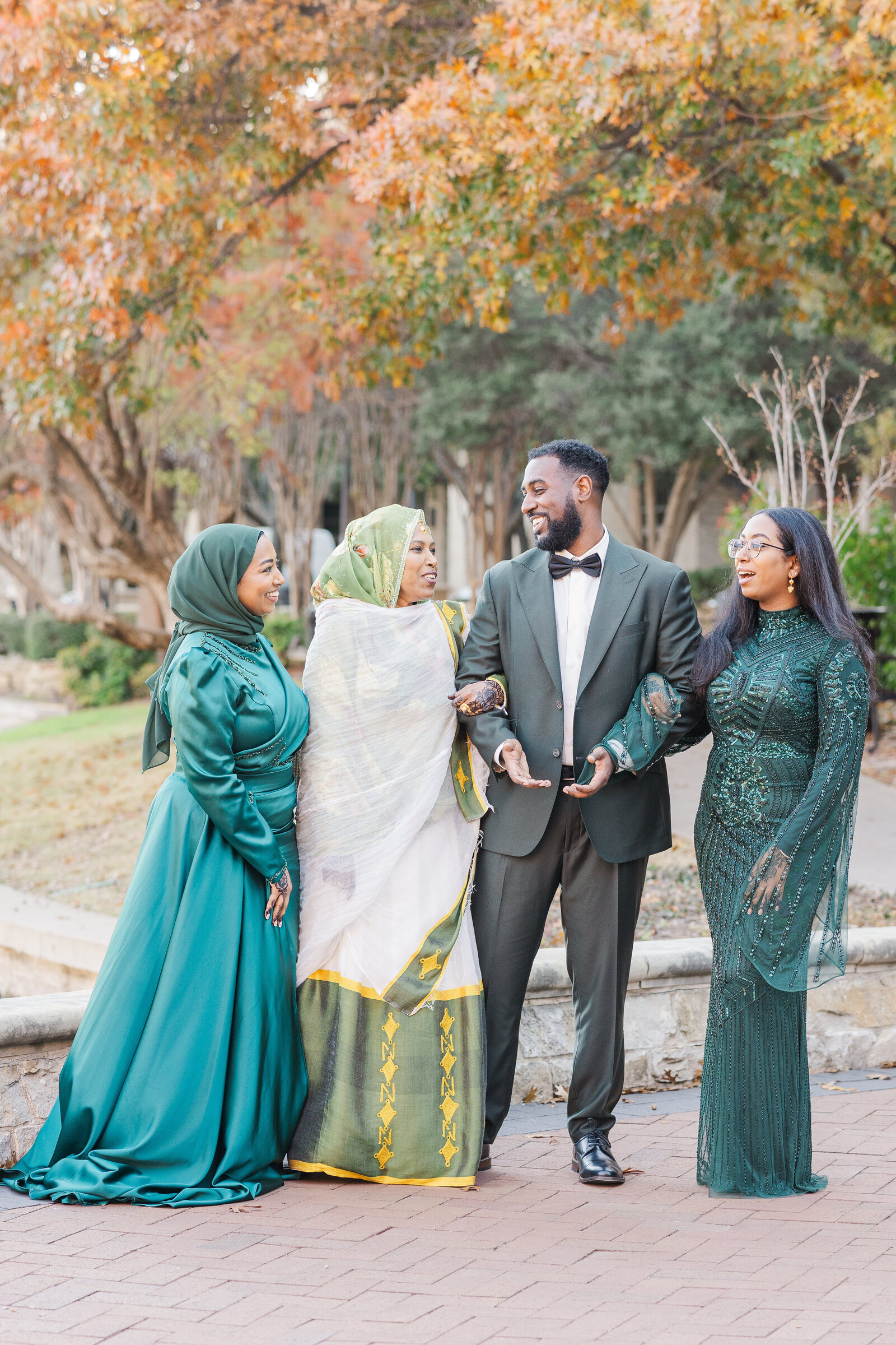 Groom with family outdoor pre wedding