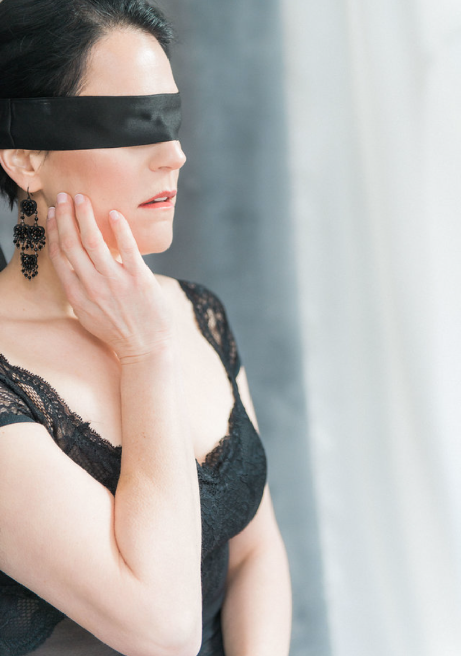 woman posing in black lingerie for  a boudoir photoshoot in Long Island NY