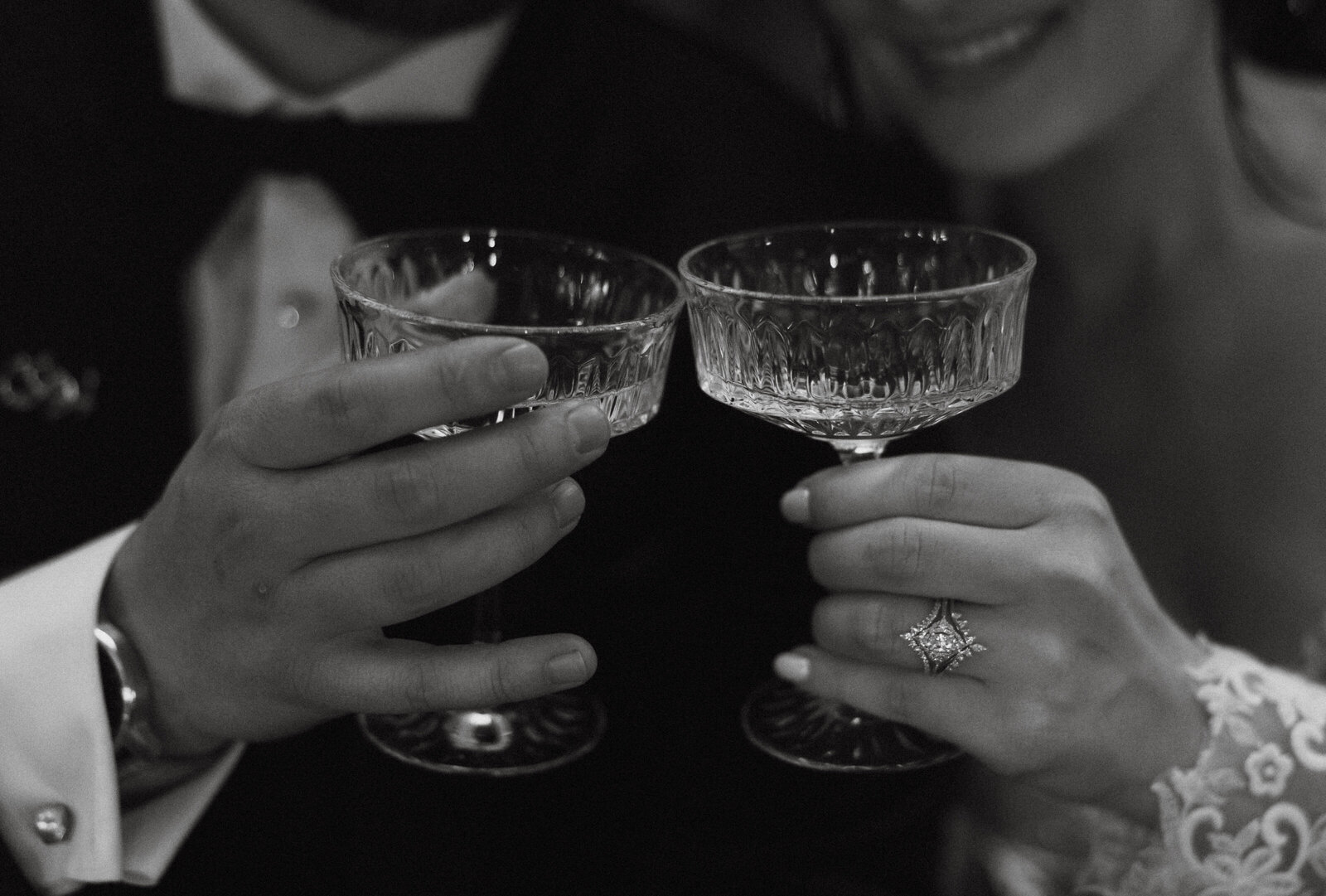 Couple cheers glasses together