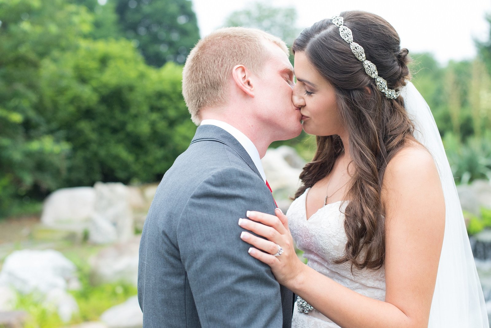 Bride and Groom Kissing at Orange County Arboretum in Campbell Hall, New York Photo