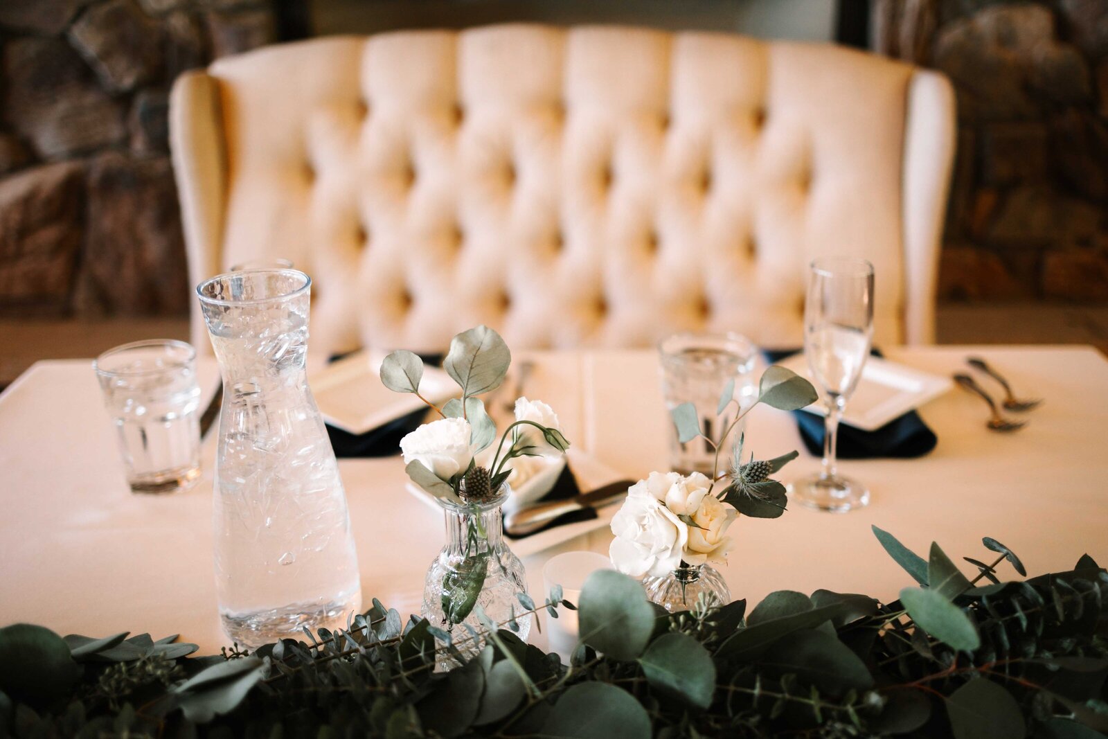 Elegant bride and groom wedding reception table and chair