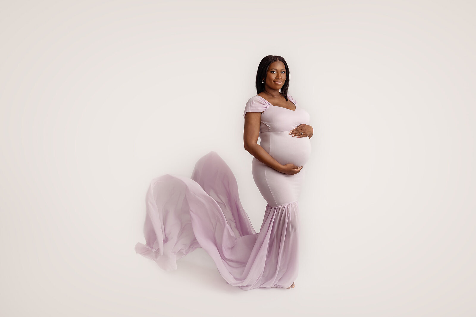 pregnant woman holding baby belly