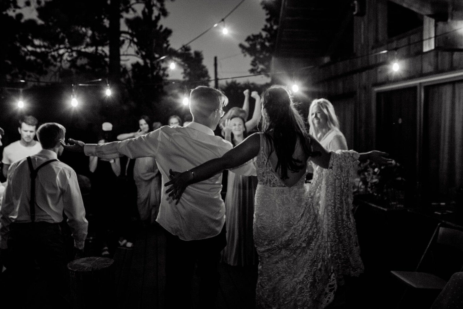 bride and groom dancing at night in red feather lakes