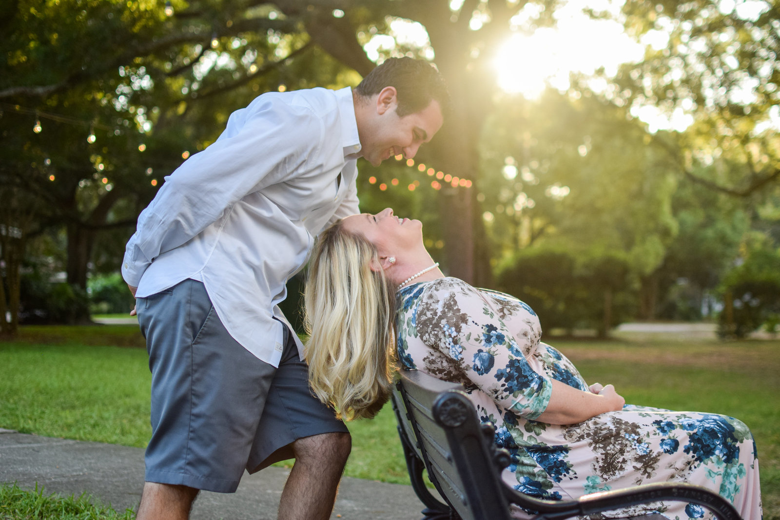 Maternity Pregnant Couple Smiling on Bench Windermere Florida