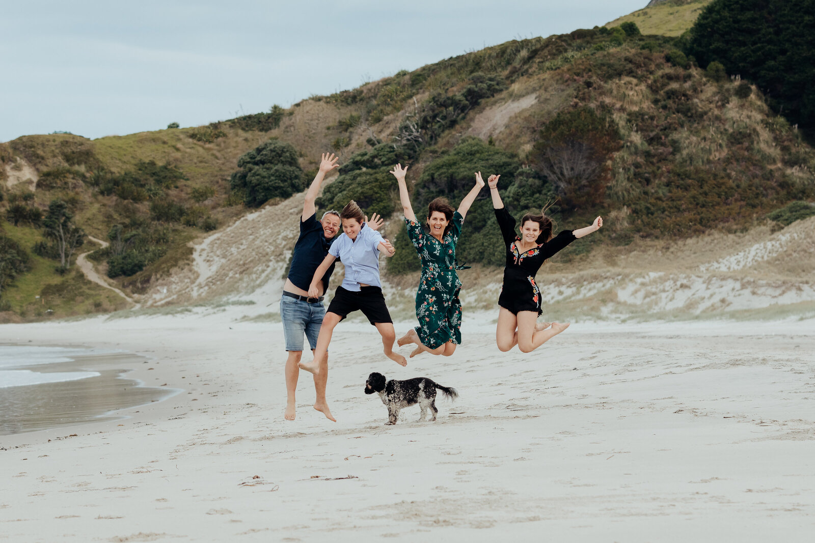 Crazy family jumping for a portrait by Whangarei photographer Tracey Morris.