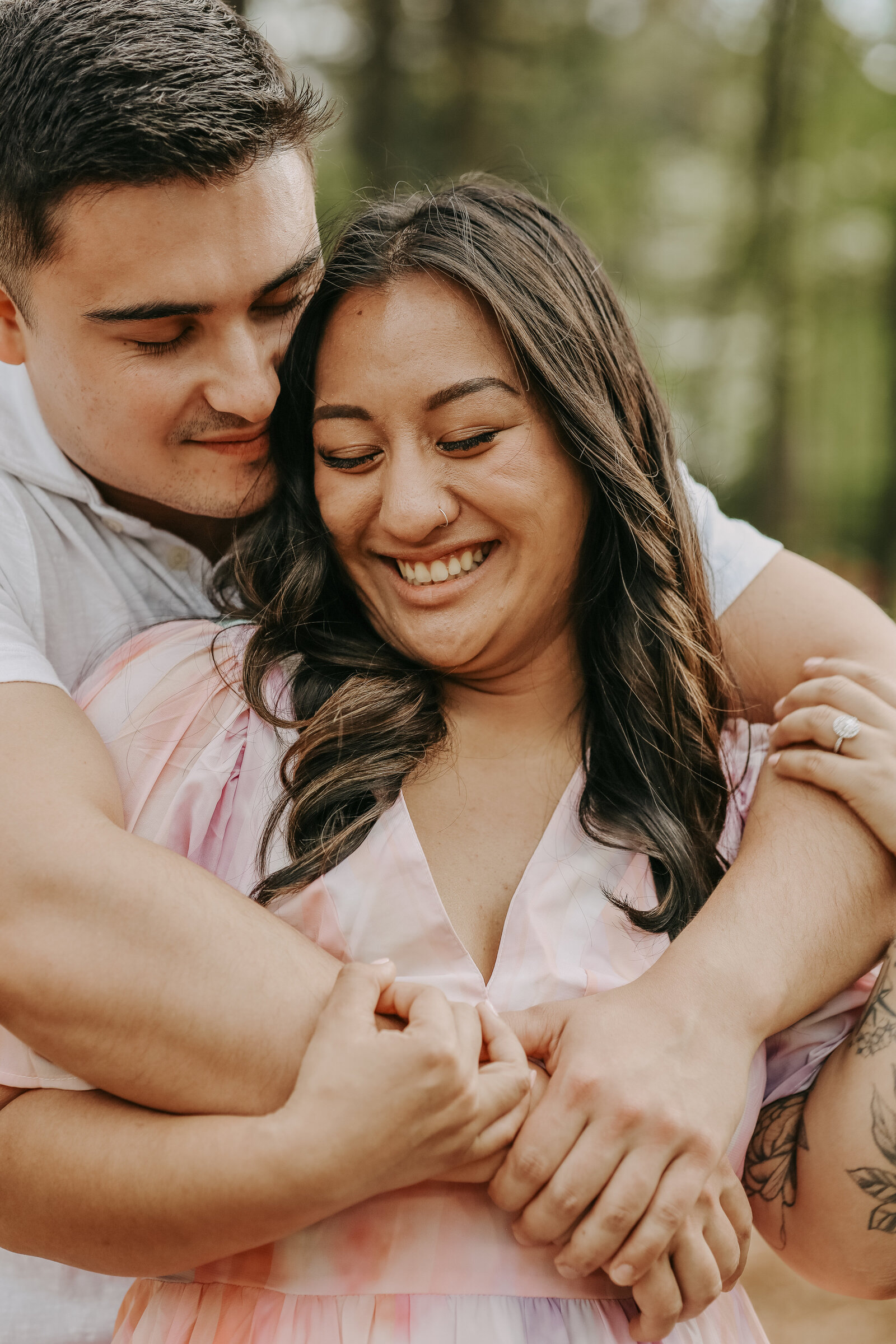 Robert holds Alexa close, sharing a romantic moment at Dixon Gardens in Memphis.