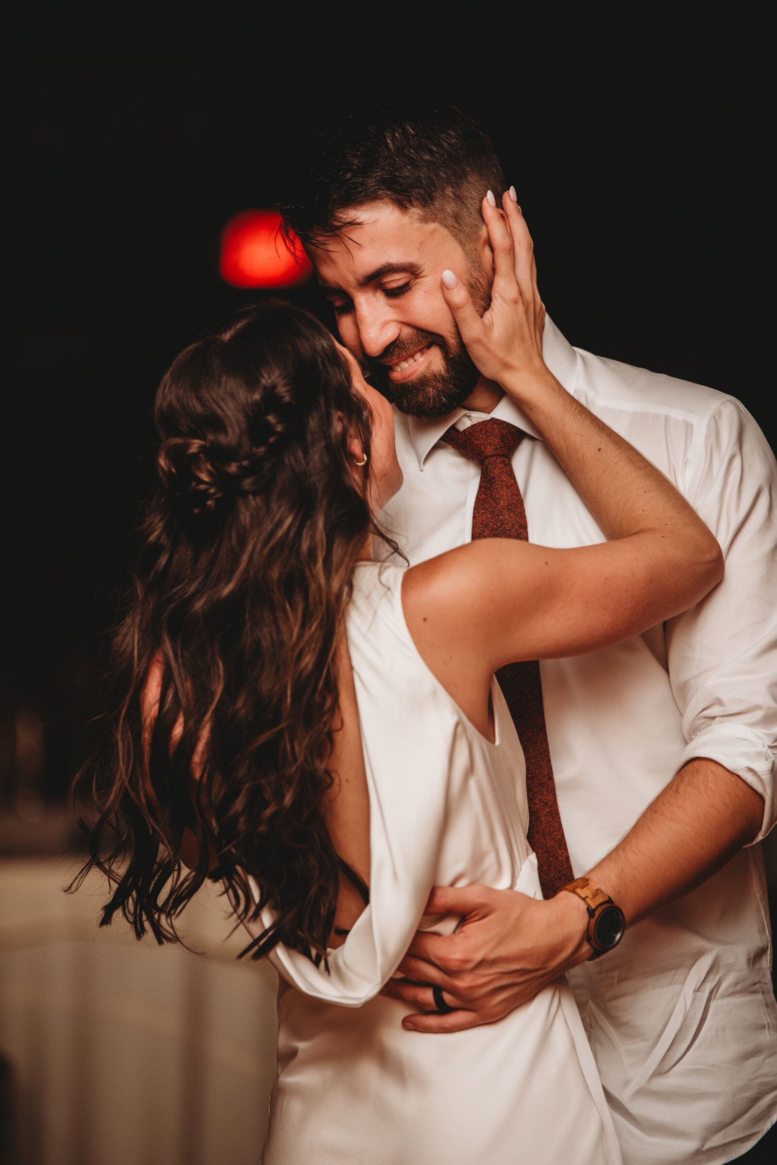 A newlywed couple shares an intimate and joyful first dance at their wedding reception in Connecticut. Capturing raw emotion, love, and happiness, this candid wedding moment showcases the beauty of storytelling through photography. Perfect inspiration for romantic wedding receptions and unforgettable celebrations.