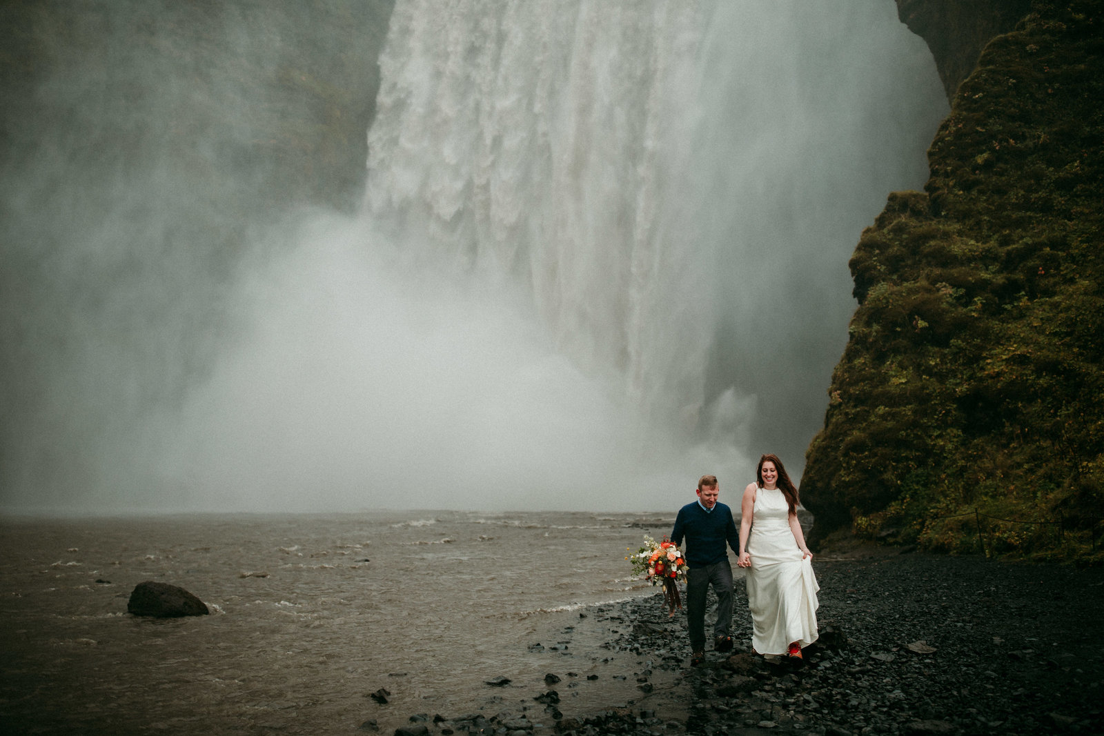 couple eloping at skogafoss waterfall in iceland