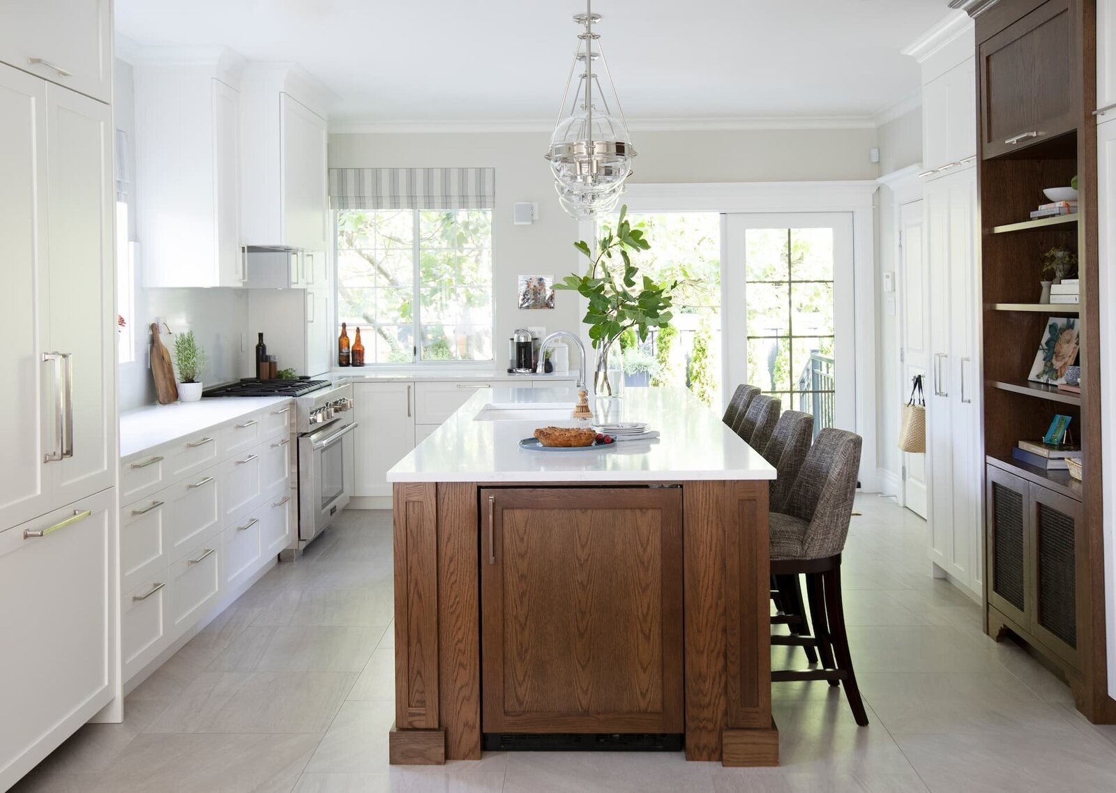 Granville Street l Kitchen l White Shaker Cabinet with Wood Island and Globe_Chrome Pendants