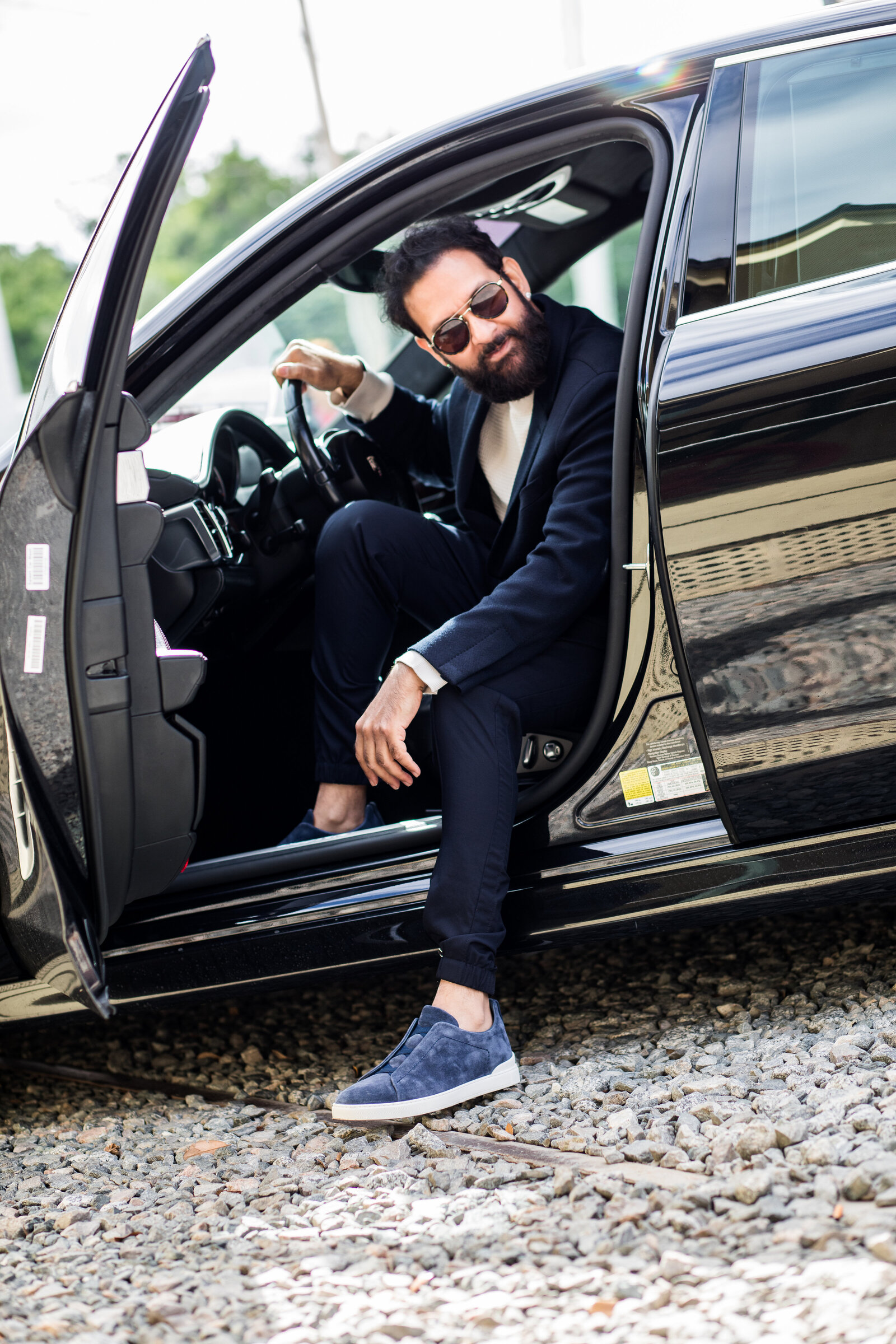 Fashion shot of man coming out of vehicle