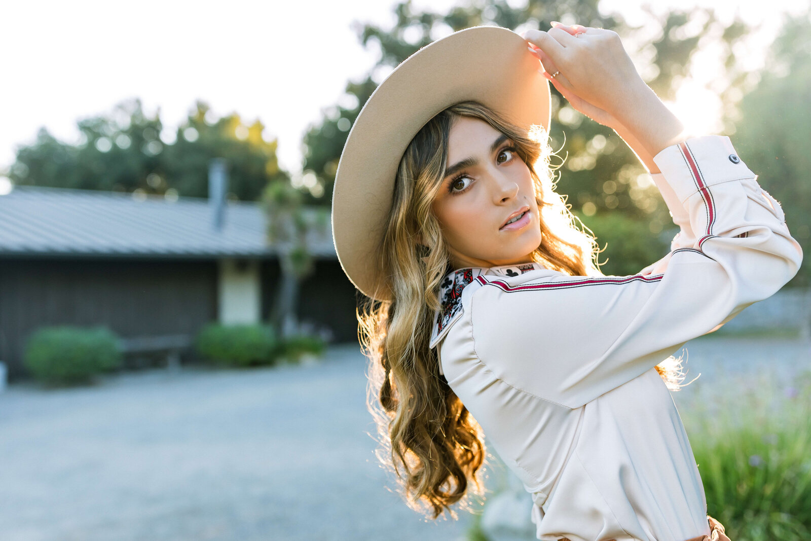 dirty blonde girl wearing a hat and white jacket