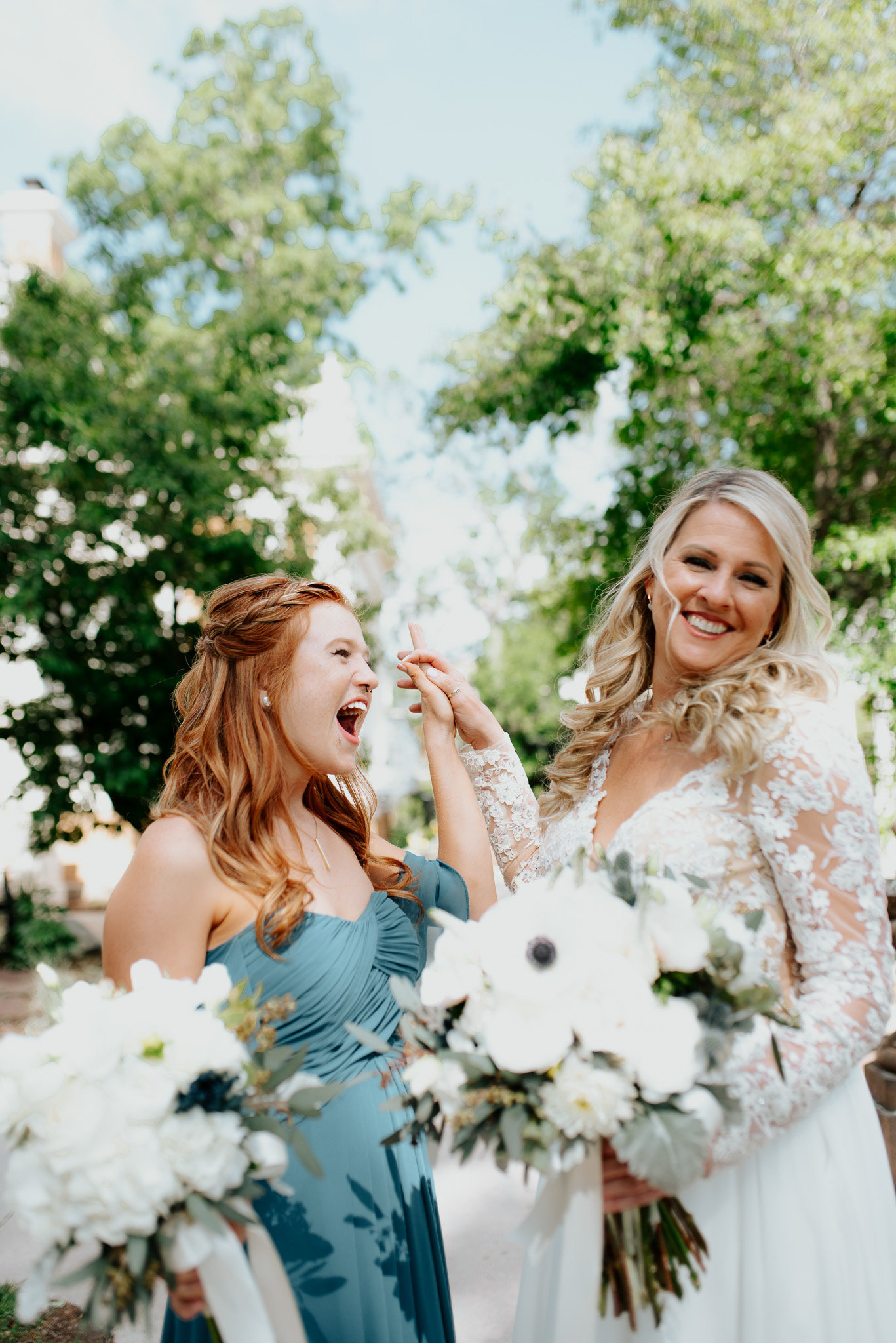 Great photo of bride and bridesmaid dancing and laughing together at grant humphrey's mansion.