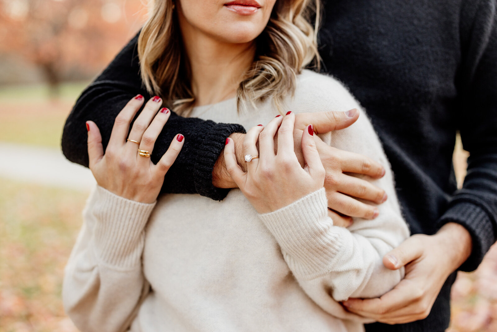 couple in colorful fall leaves