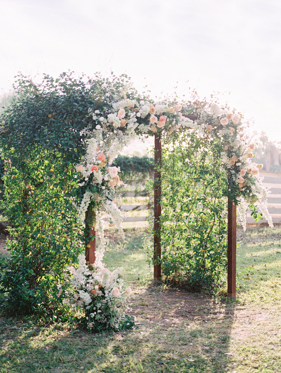 wedding-florist-lush-wedding-arch-greenery-flowers