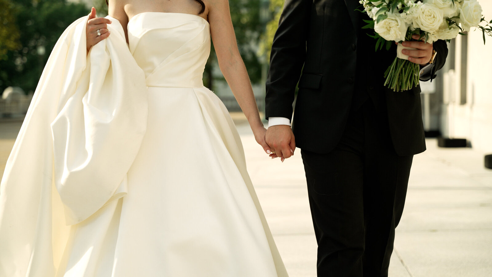 Bride and Groom Holding Hands (1)
