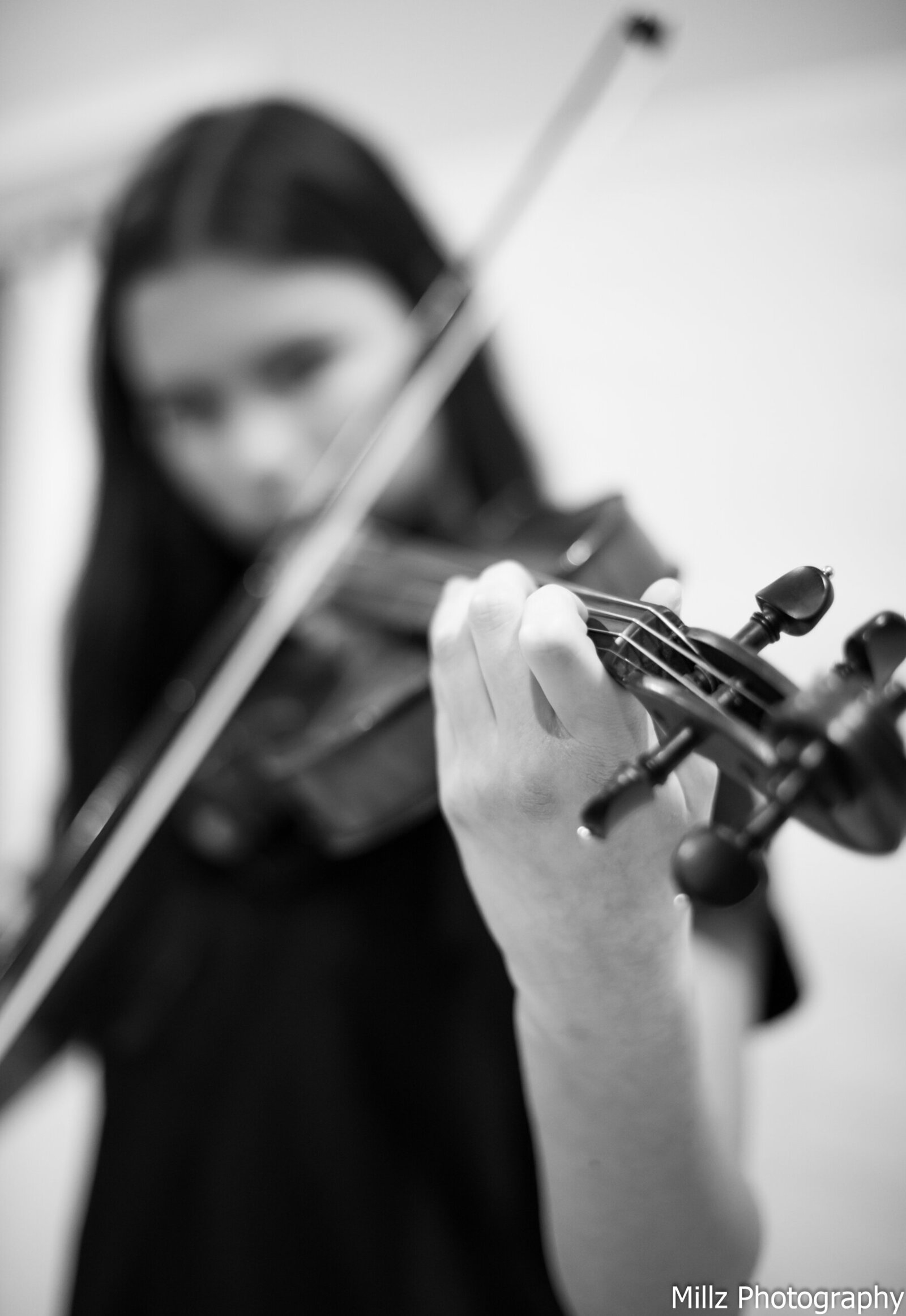 girl playing a violin photographed by Millz Photography in Greenville, SC