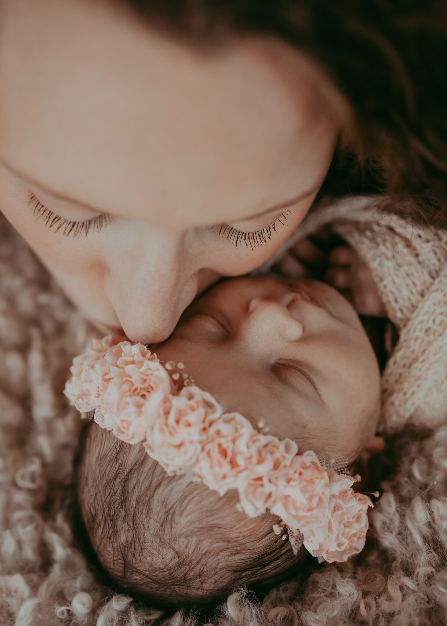 detail fine art portrait of newborn mom kissing her baby girl