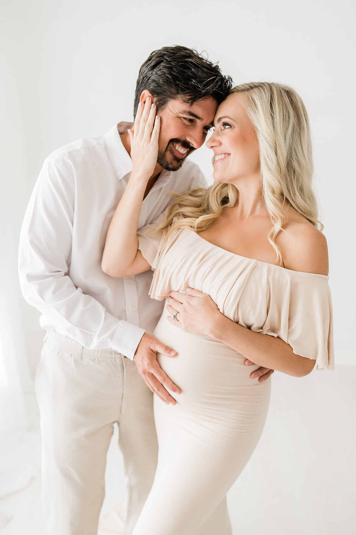 a pregnat couple during their photo studio session by Destin maternity photographer