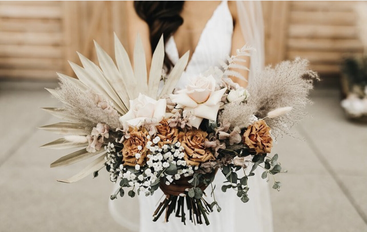 Bridal bouquet with a mix of fresh and dried elements.