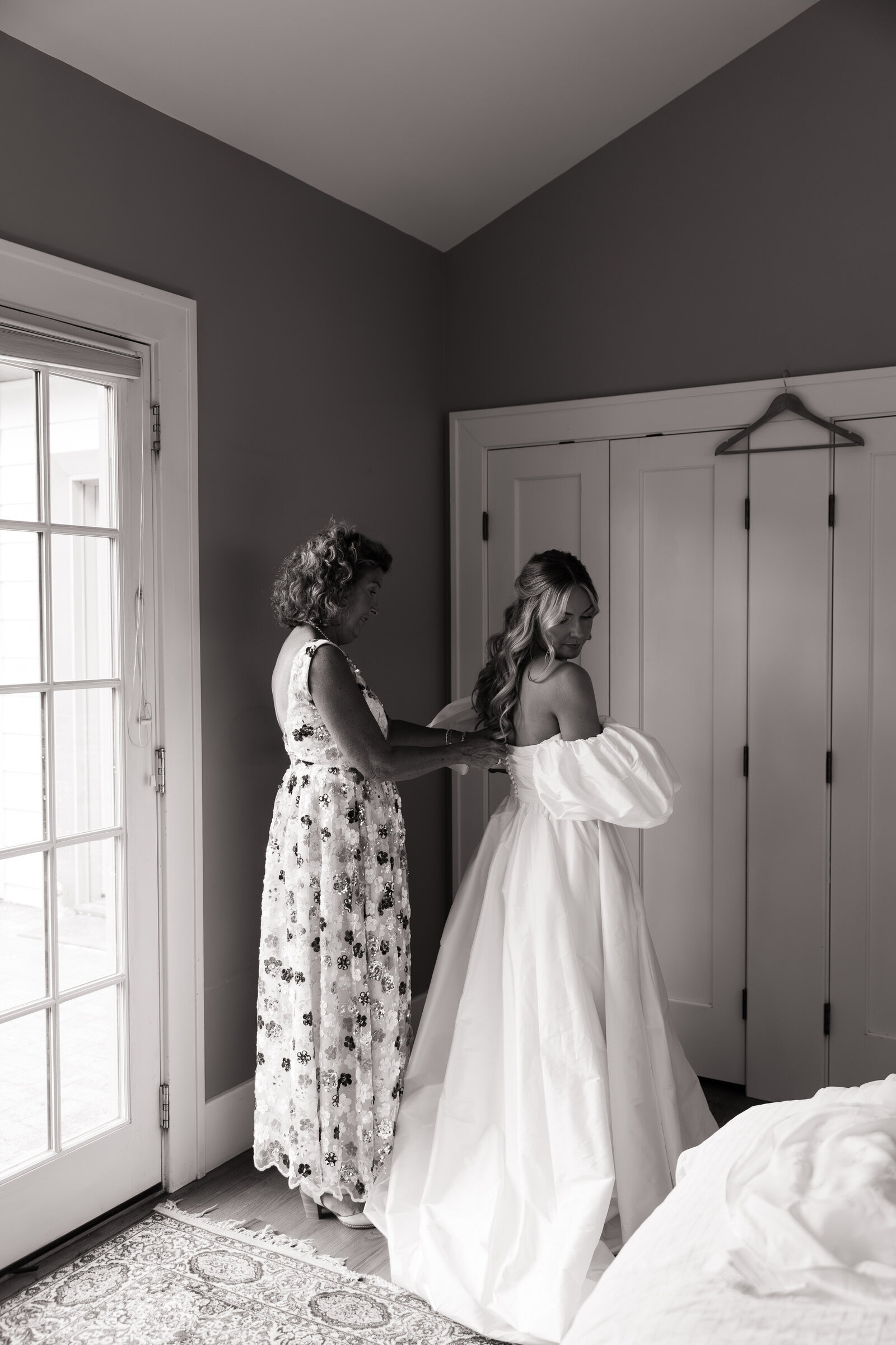 Mother of bride zips up bride's dress for first look at TRICA in Boise
