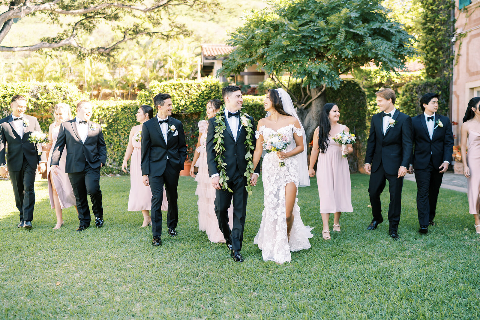 wedding party walking across lawn at La Pietra School For Girld