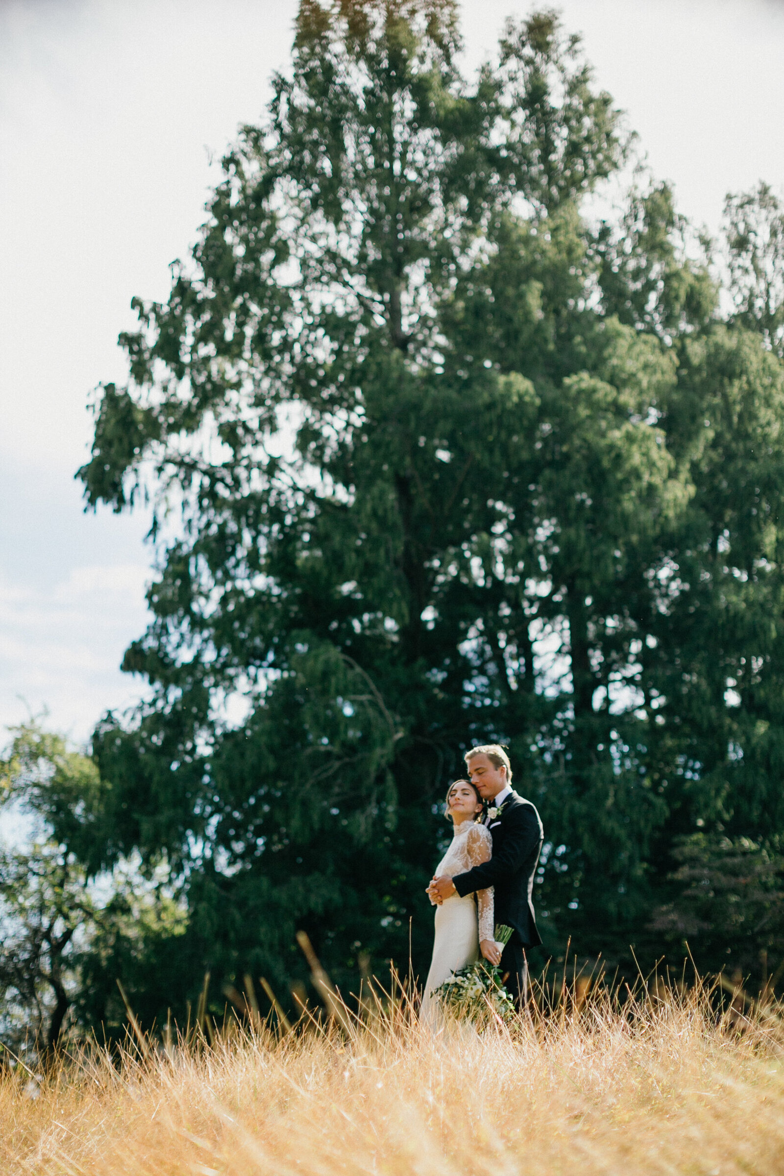 The couple shares a quiet moment at sunset during their Radnor Hunt Landing wedding.