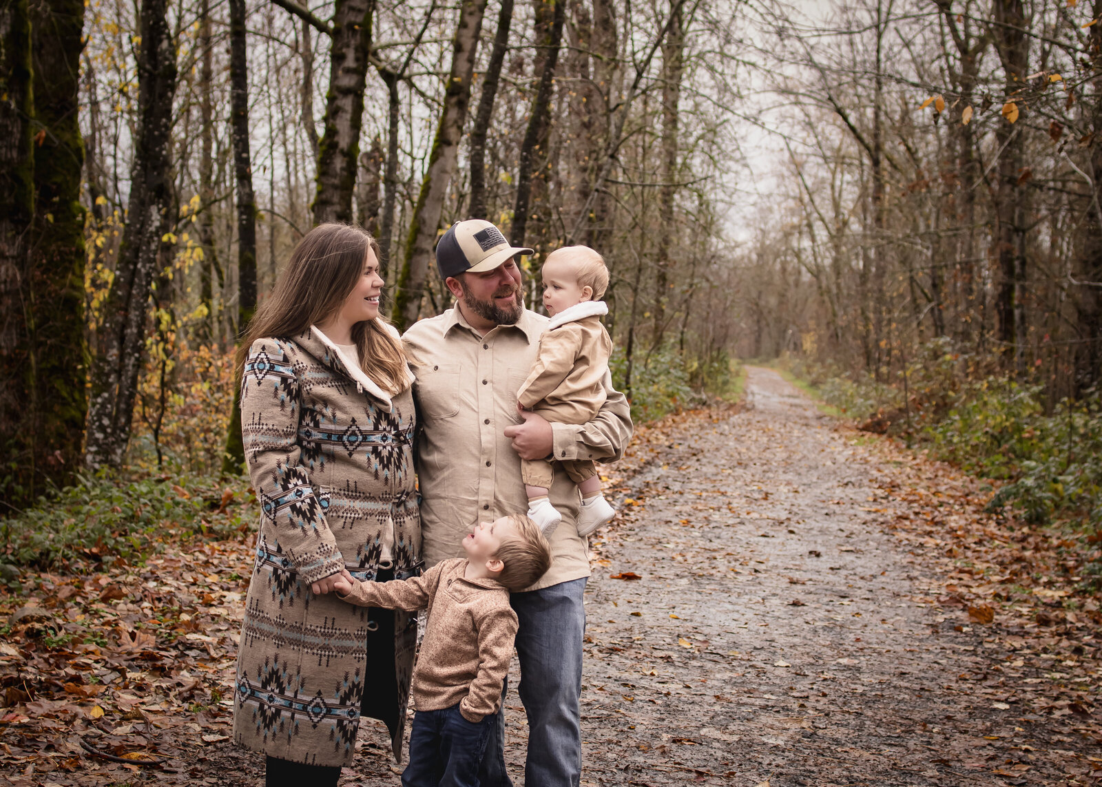Family of 4 taking photos in the rain